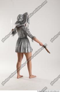LUCI_AVIOL STANDING POSE WITH GUN AND SWORD